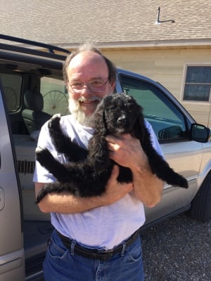 Tucker is in puppy heaven with these two sweet girls to love on!